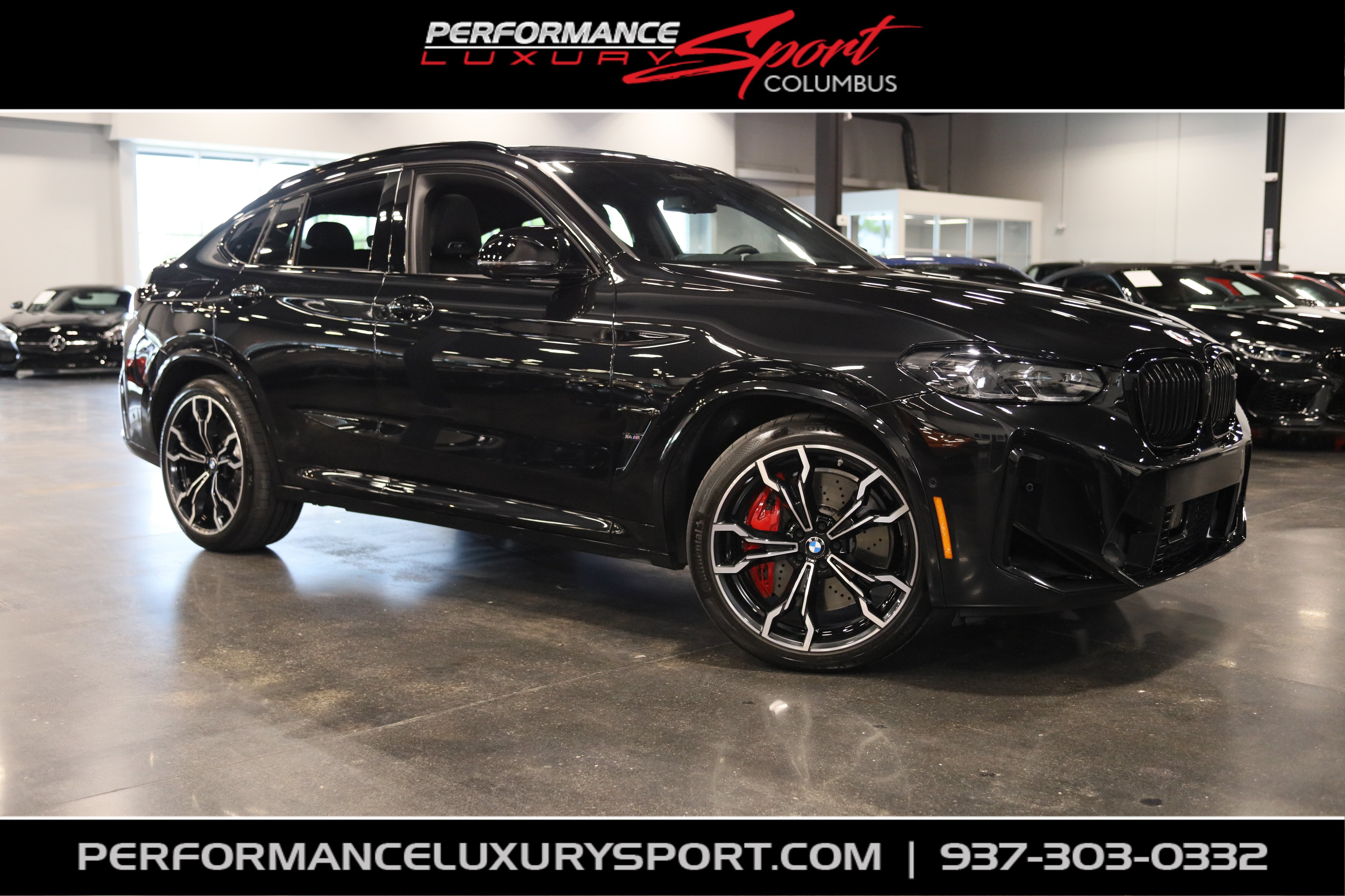 2023 BMW X4 M Competition in Black Sapphire Metallic — front three-quarter view