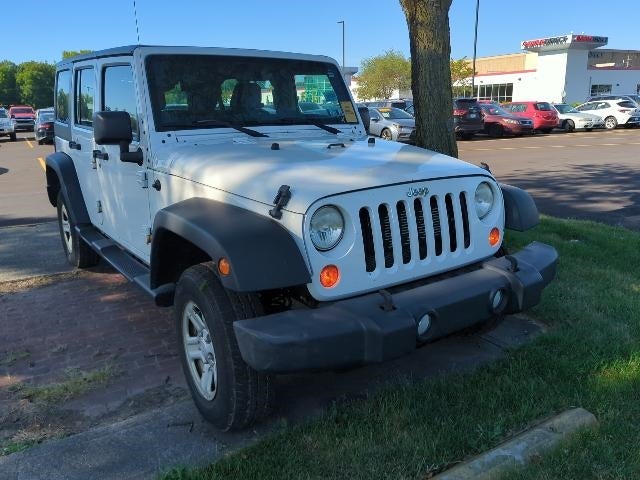 2013 Jeep Wrangler — rear three-quarter view