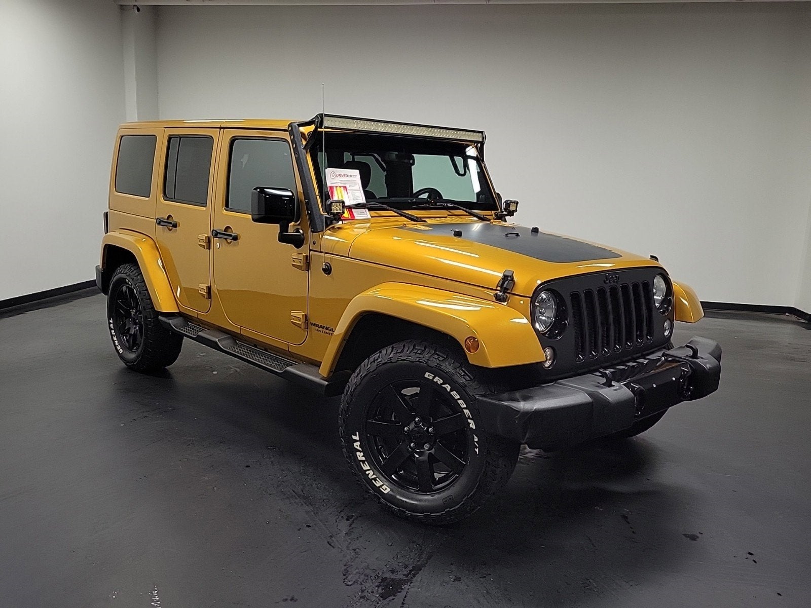 2014 Jeep Wrangler — rear three-quarter view