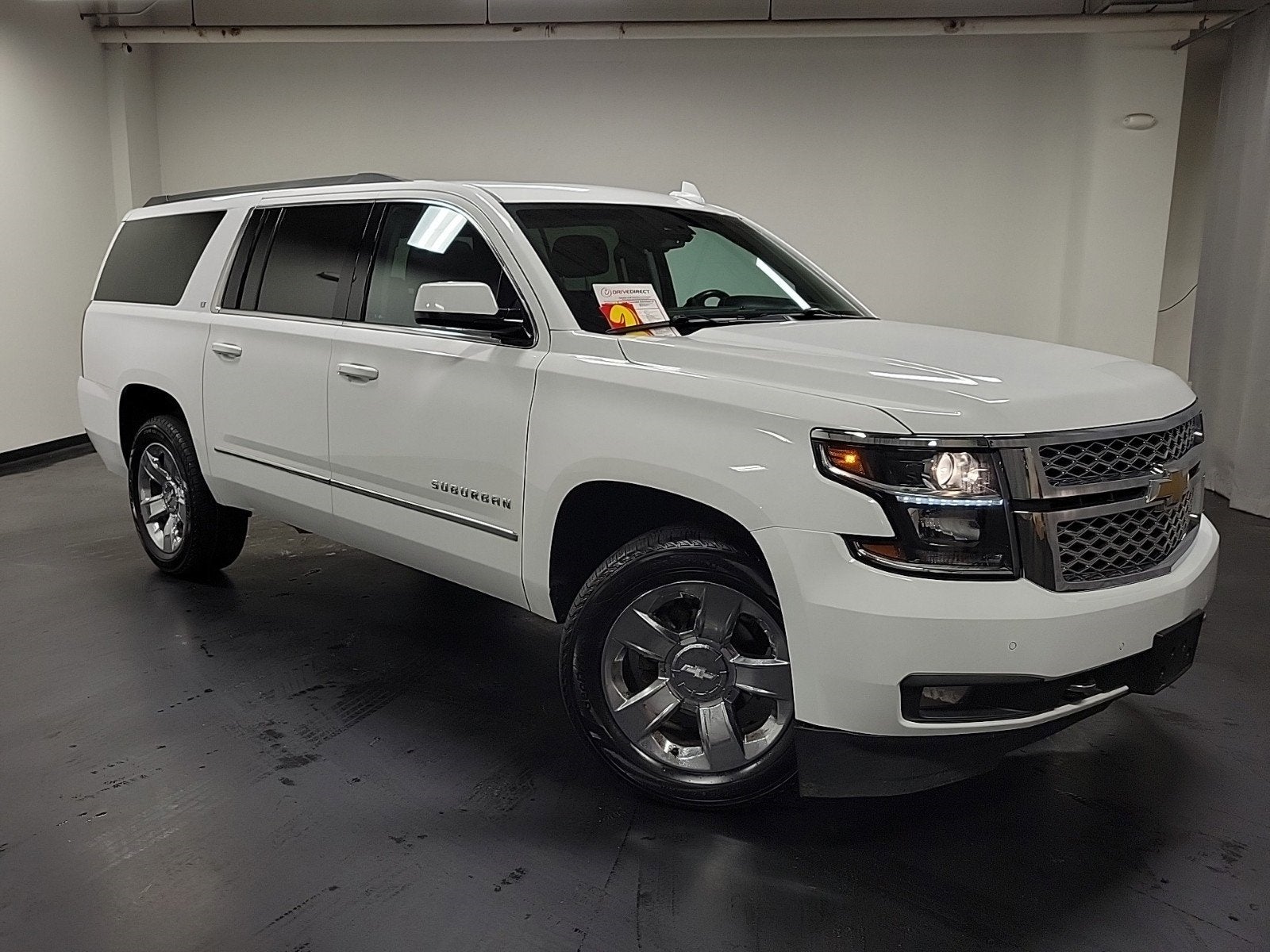2018 Chevrolet Suburban LT in Summit White — front three-quarter view