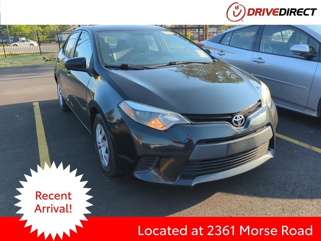 2016 Toyota Corolla L in Black Sand Pearl — front three-quarter view