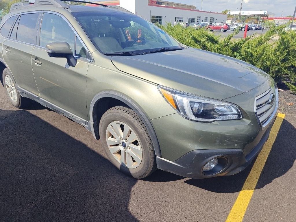 2016 Subaru Outback 2.5i Premium in Wilderness Green Metallic — front three-quarter view