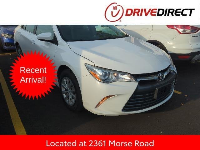 2015 Toyota Camry LE in Super White — front three-quarter view