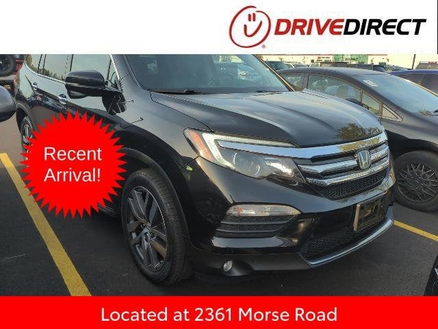 2016 Honda Pilot Touring in Crystal Black Pearl — front three-quarter view