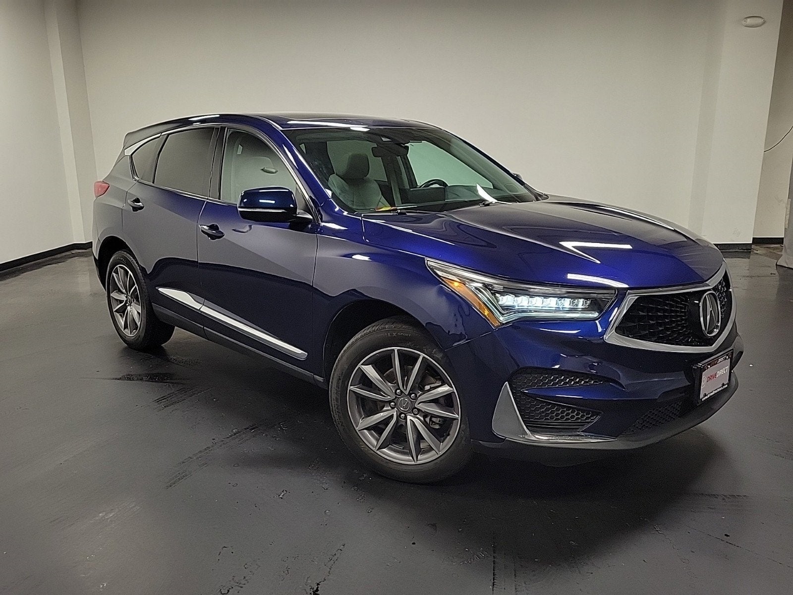 2021 Acura RDX Technology Package in Apex Blue Pearl — front three-quarter view