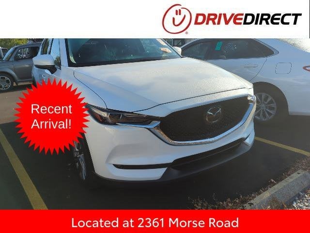 2019 Mazda Mazda CX-5 Grand Touring in Snowflake White Pearl Mica — front three-quarter view