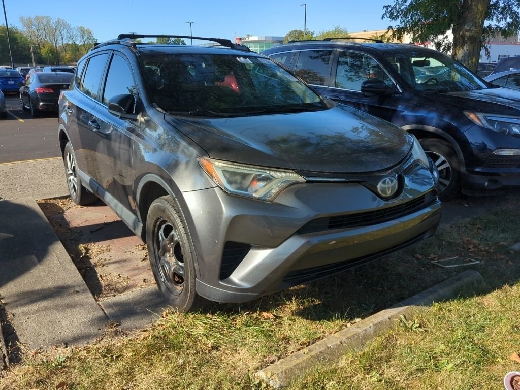 2017 Toyota RAV4 LE in Black — front three-quarter view