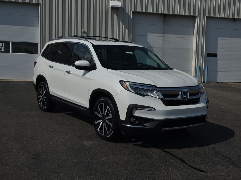 2022 Honda Pilot Elite in Platinum White Pearl — front three-quarter view