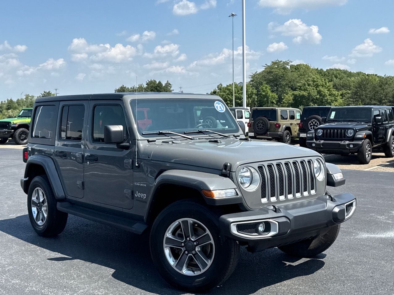 2021 Jeep Wrangler Unlimited Sahara in Sting-Gray Clearcoat — front three-quarter view