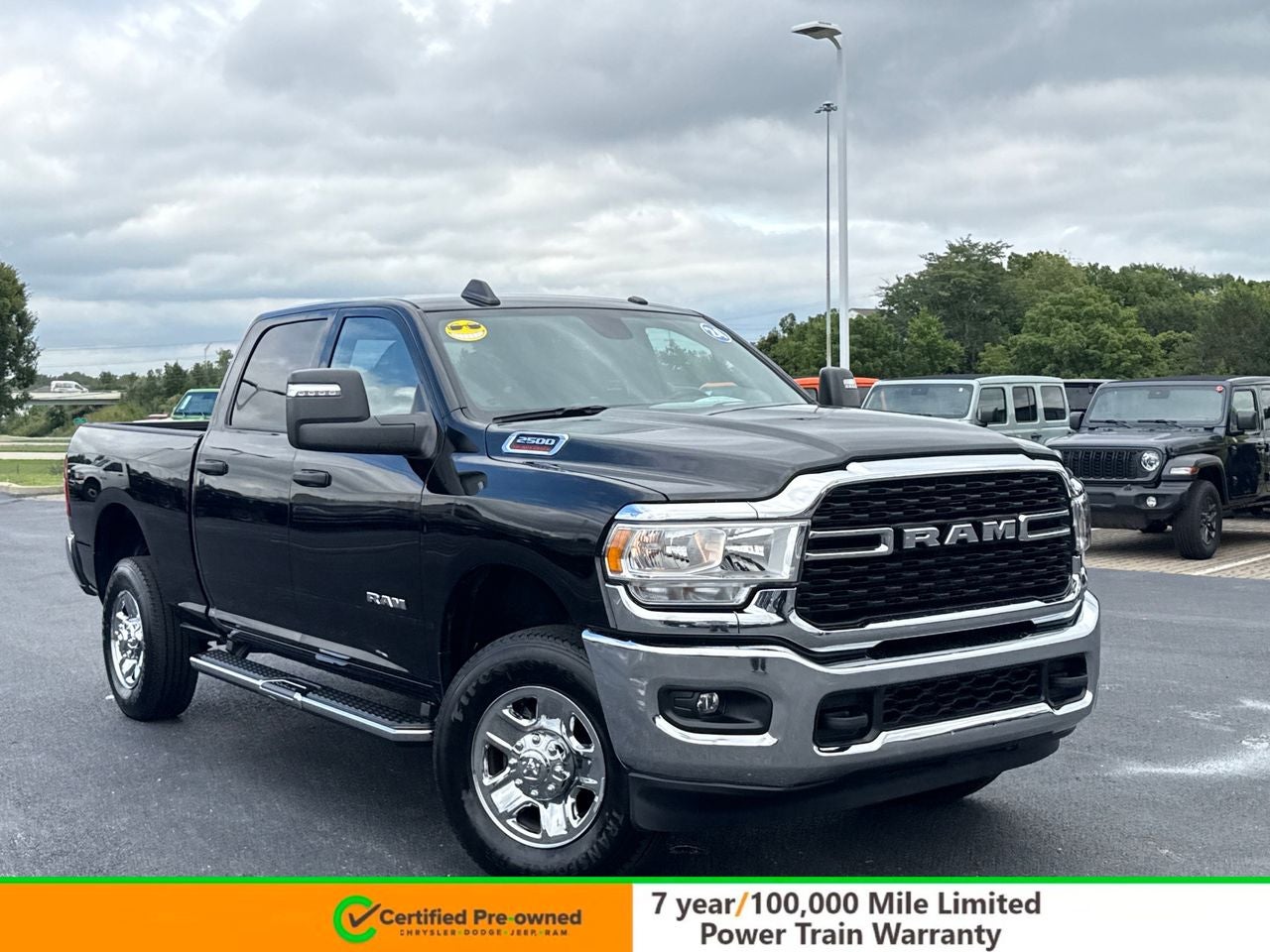 2024 RAM 2500 Big Horn Crew Cab 4x4 6'4' Box in Diamond Black Crystal Pearlcoat — front three-quarter view