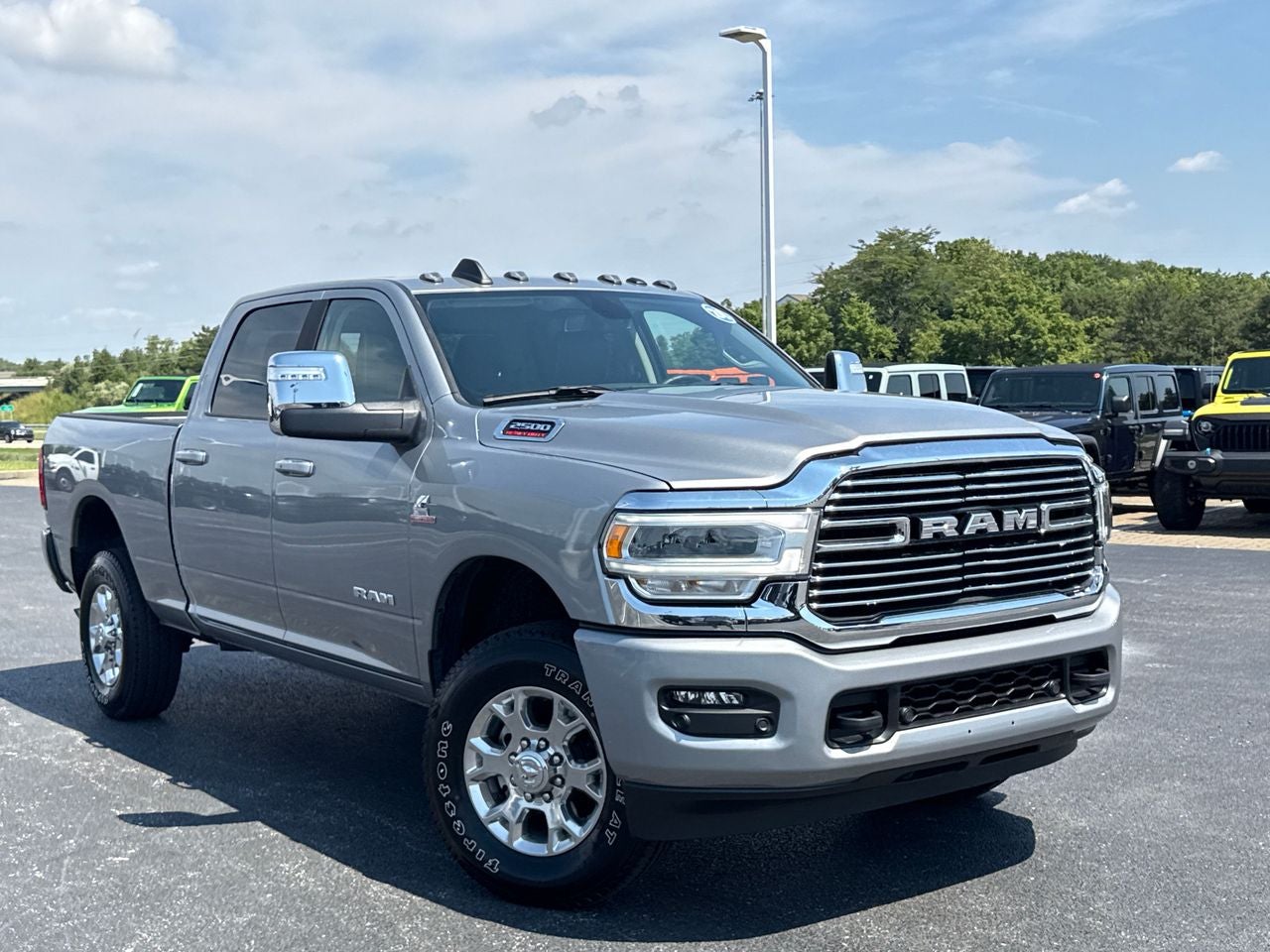 2024 RAM 2500 Laramie Crew Cab 4x4 6'4' Box in Billet Silver Metallic Clearcoat — front three-quarter view