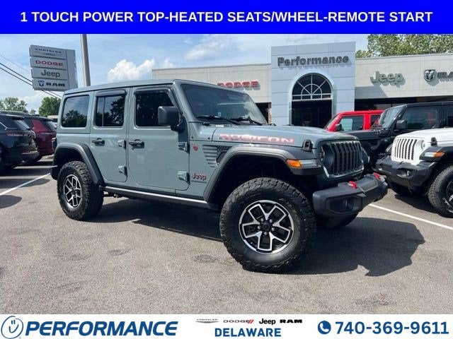 2024 Jeep Wrangler Rubicon in Anvil Clear Coat — front three-quarter view