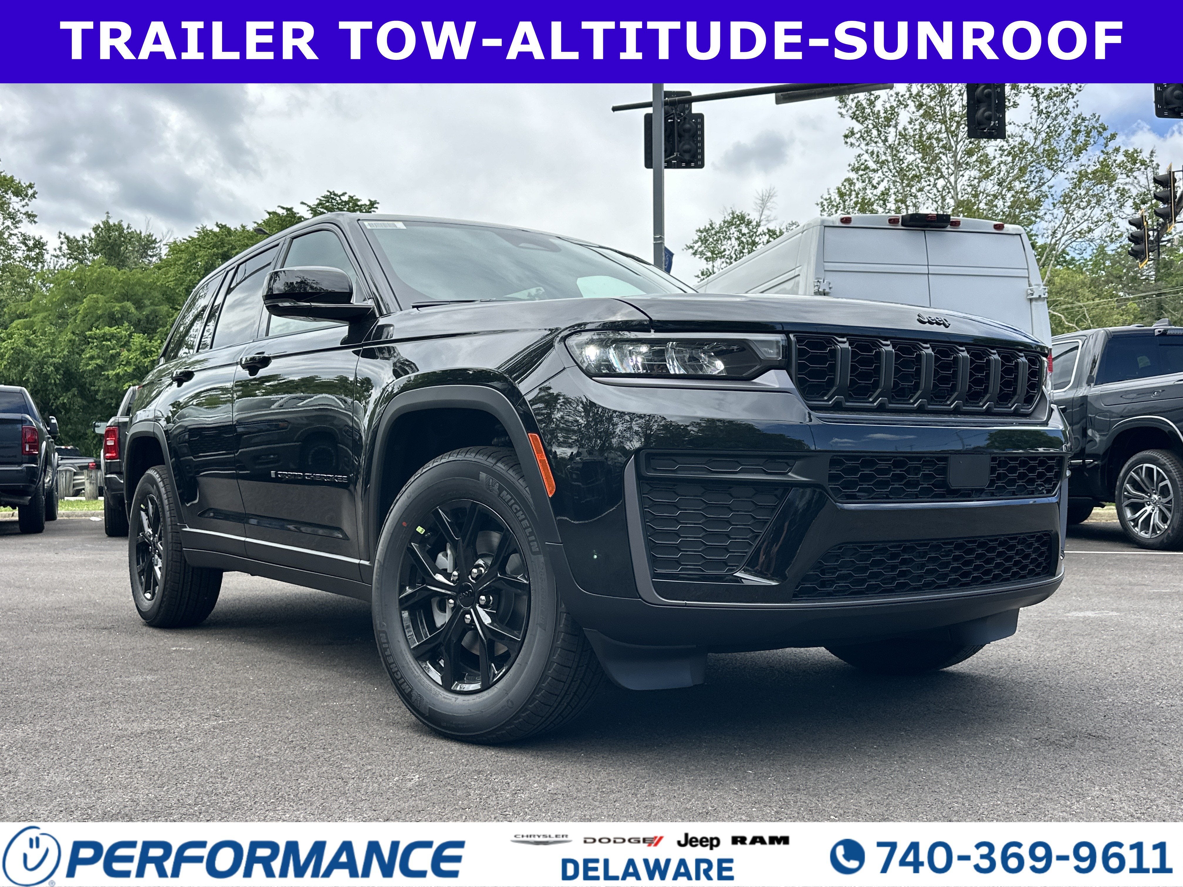 2026 Jeep Grand Cherokee Laredo Altitude in Diamond Black Crystal Pearlcoat — front three-quarter view