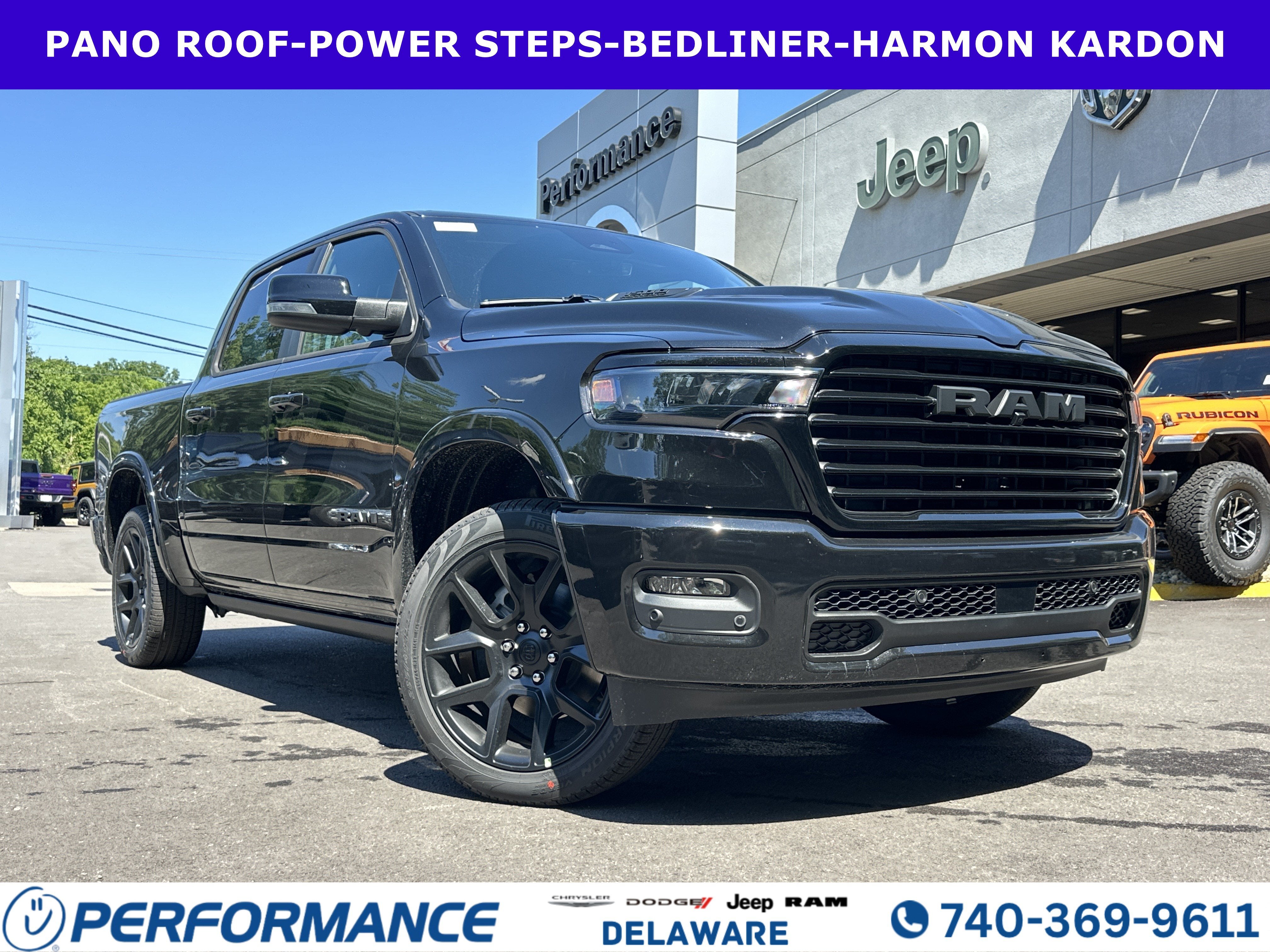 2026 RAM 1500 Laramie in Diamond Black Crystal Pearlcoat — front three-quarter view