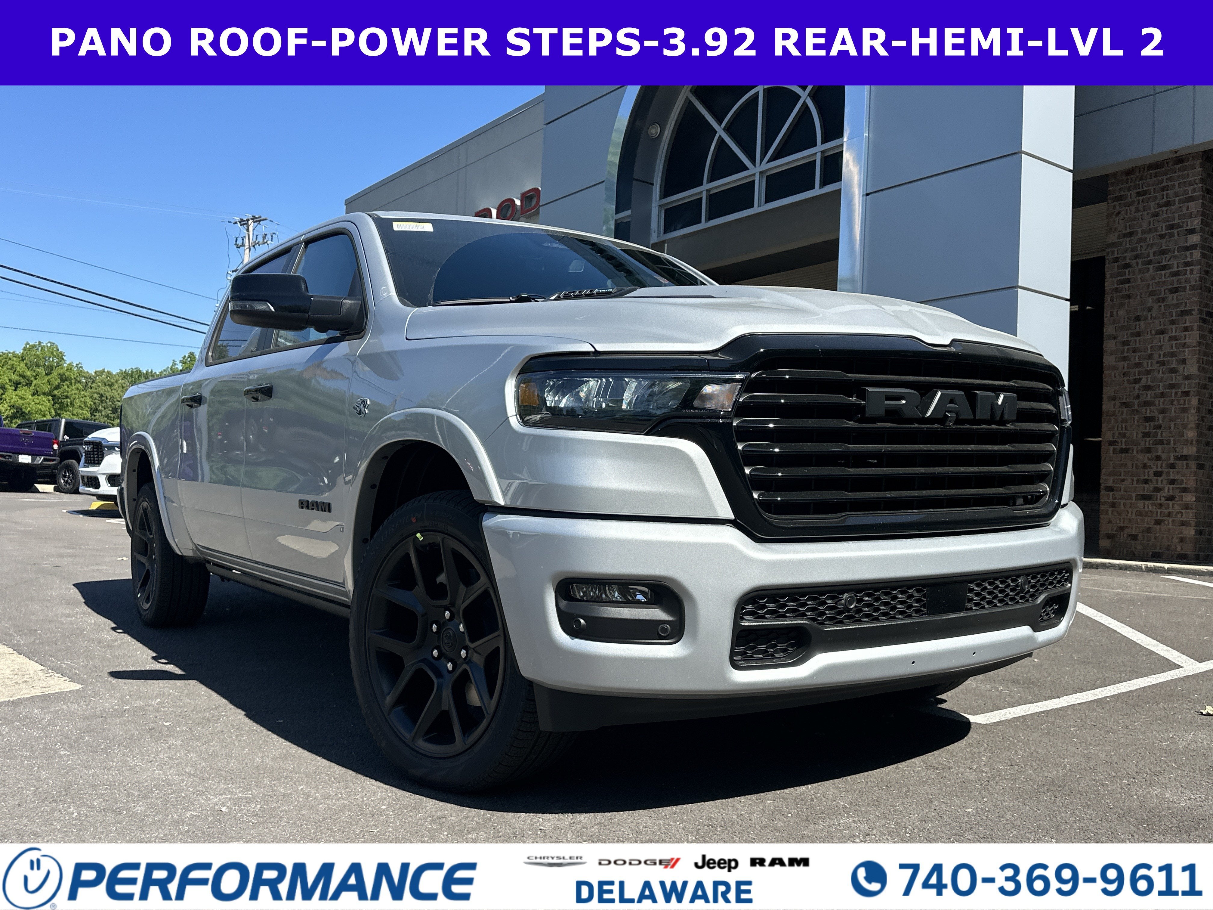 2026 RAM 1500 Laramie in Silver Zynith — front three-quarter view