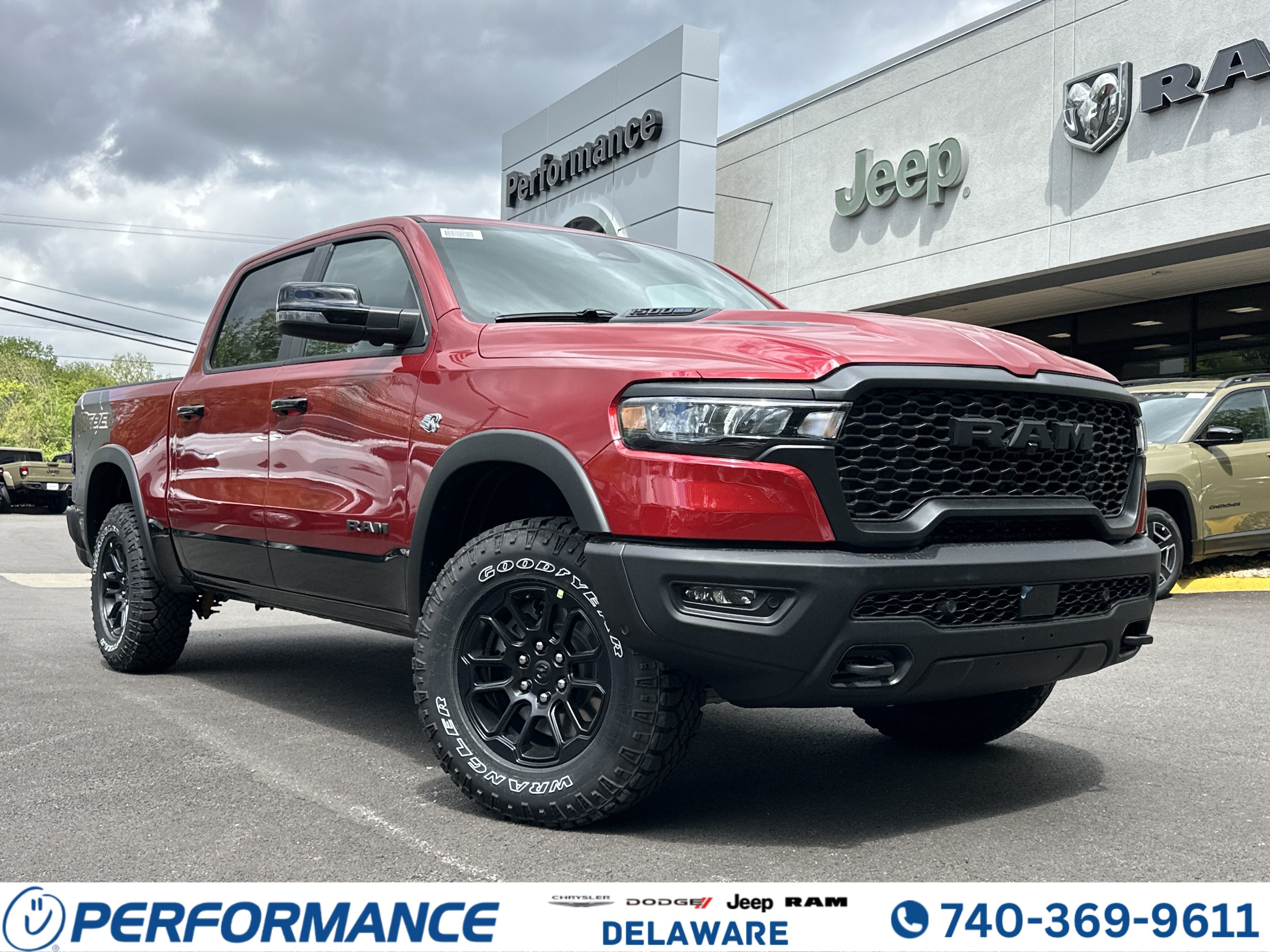 2026 RAM 1500 Rebel in Molten Red Pearlcoat — front three-quarter view