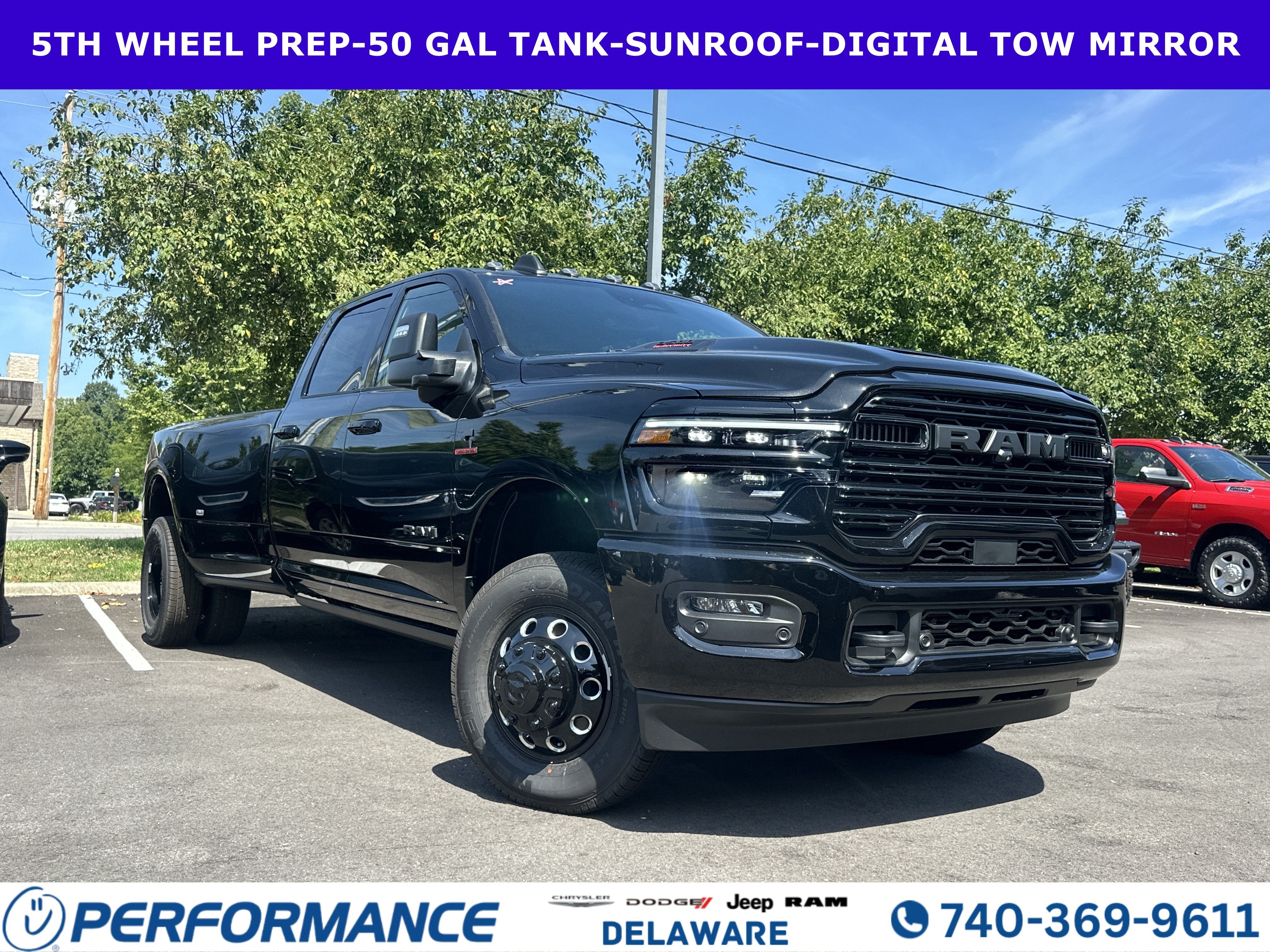 2026 RAM 3500 Laramie in Diamond Black Crystal Pearlcoat — front three-quarter view
