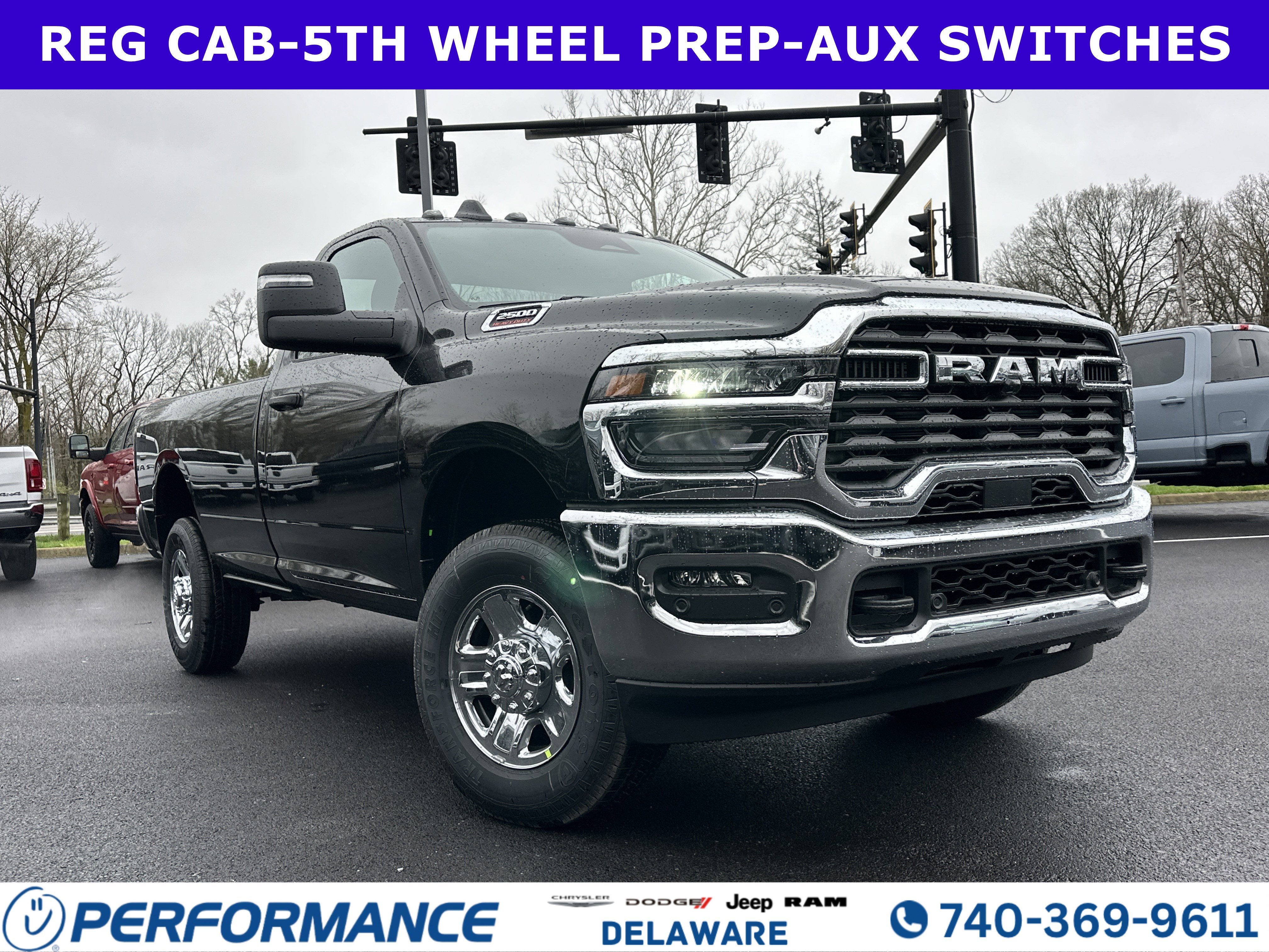 2026 RAM 2500 Tradesman in Diamond Black Crystal Pearlcoat — front three-quarter view