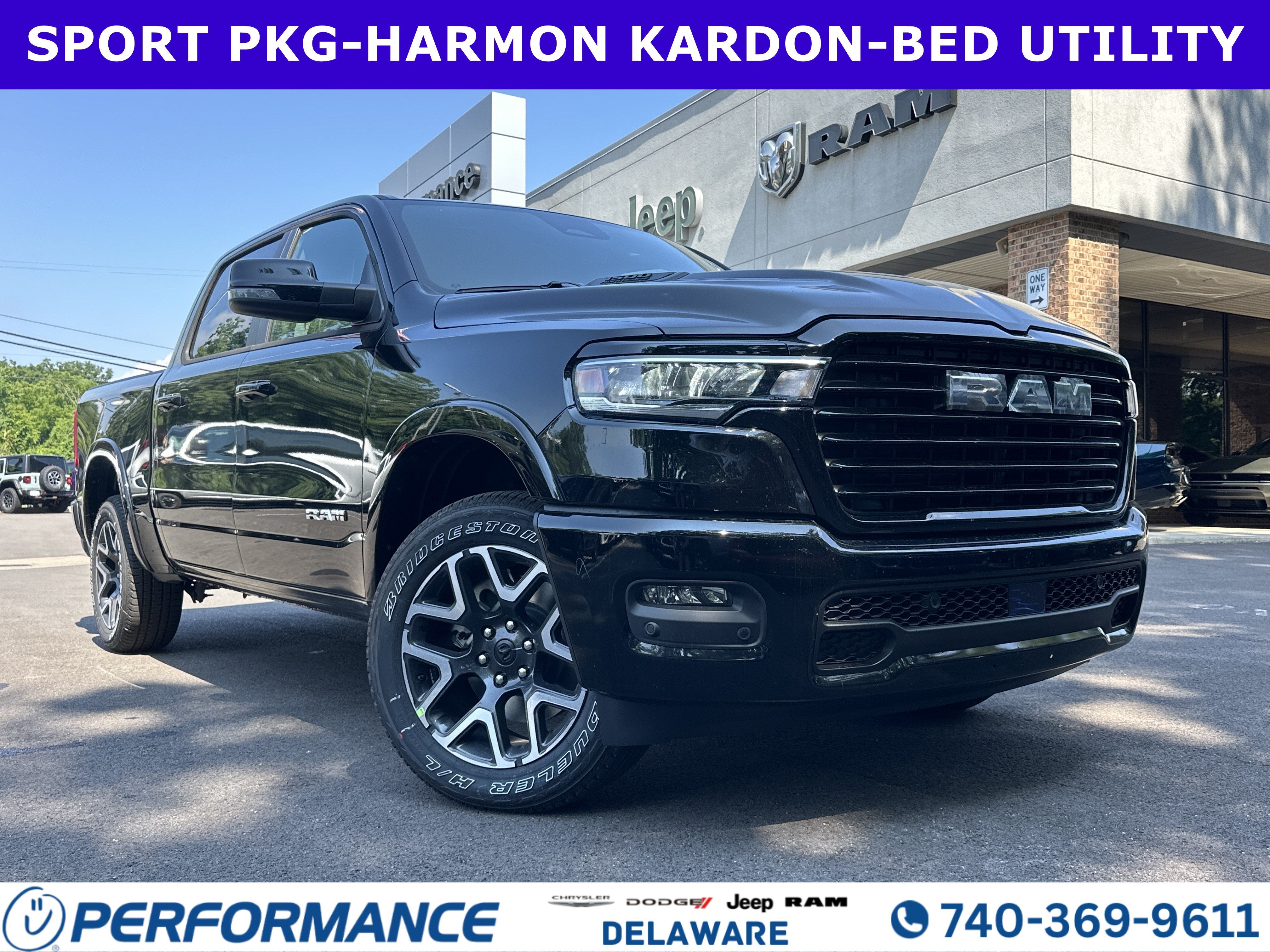 2026 RAM 1500 Laramie in Diamond Black Crystal Pearlcoat — front three-quarter view