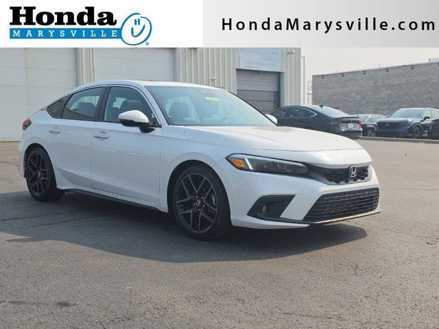 2024 Honda Civic Hatchback Sport Touring in Platinum White Pearl — front three-quarter view