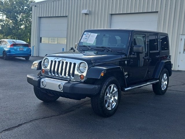 2013 Jeep Wrangler — rear three-quarter view