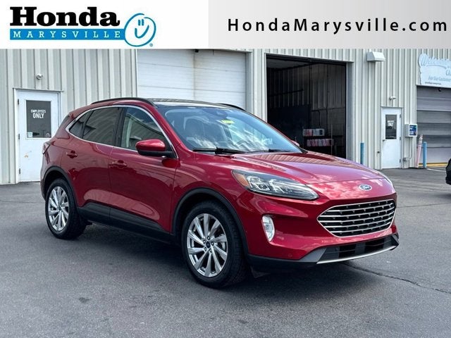 2021 Ford Escape Hybrid Titanium in Rapid Red Metallic Tinted Clearcoat — front three-quarter view