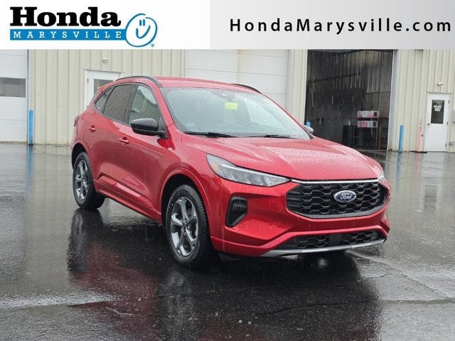 2023 Ford Escape ST-Line in Rapid Red Metallic Tinted Clearcoat — front three-quarter view