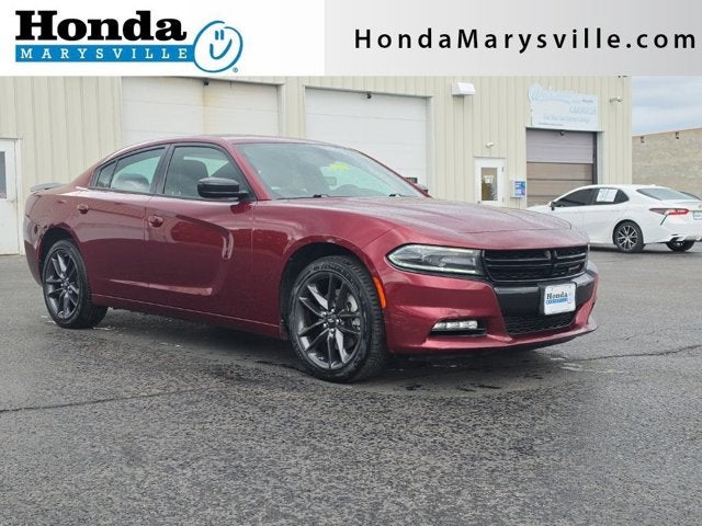 2021 Dodge Charger SXT in Octane Red Pearlcoat — front three-quarter view