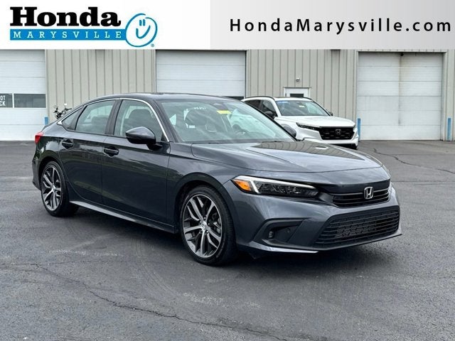2024 Honda Civic Touring in Meteorite Gray Metallic — front three-quarter view