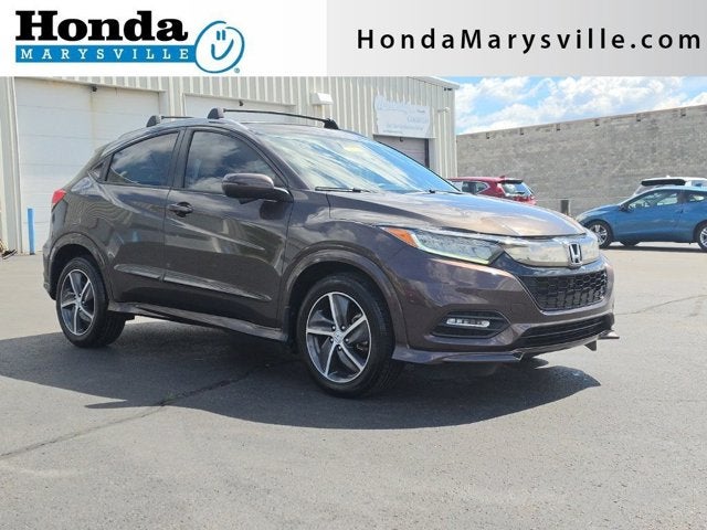 2019 Honda HR-V Touring in Midnight Amethyst Metallic — front three-quarter view
