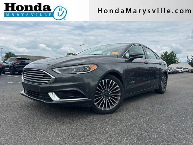 2018 Ford Fusion Hybrid SE in Magnetic Metallic — front three-quarter view
