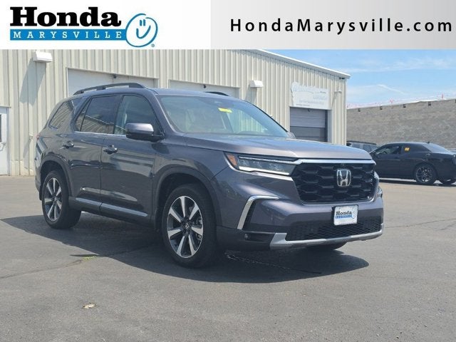 2024 Honda Pilot Elite in Modern Steel Metallic — front three-quarter view