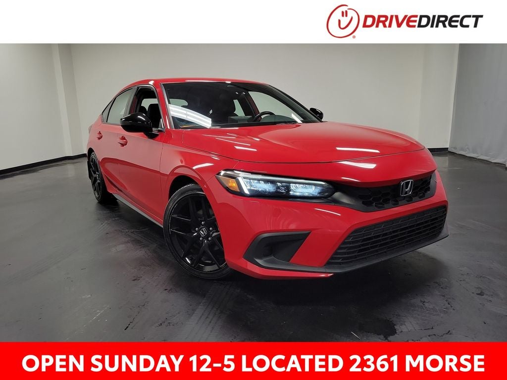 2024 Honda Civic Sport in Rallye Red — front three-quarter view