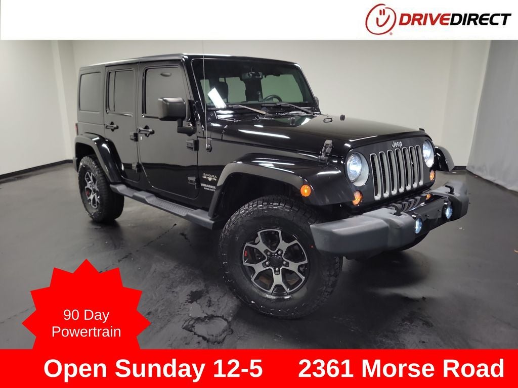 2017 Jeep Wrangler Unlimited Sahara in Black Clearcoat — front three-quarter view