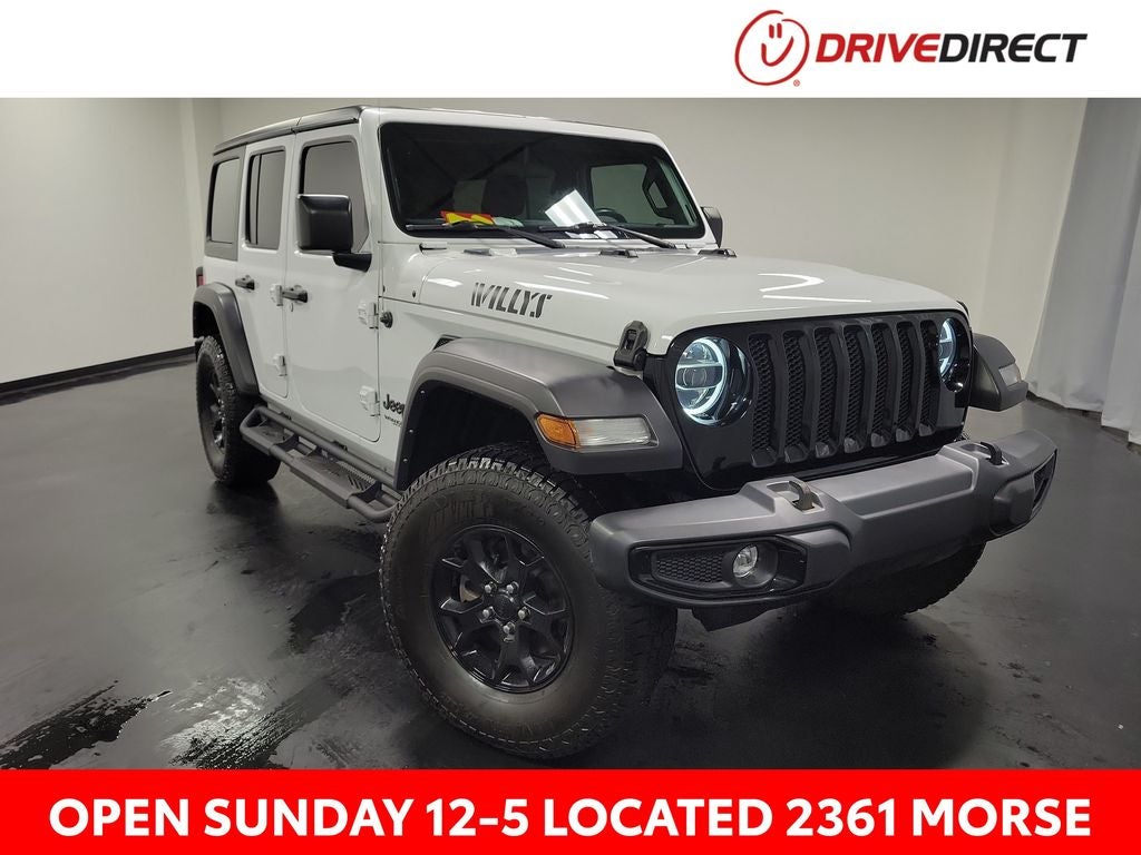2022 Jeep Wrangler Unlimited Willys in Bright White Clearcoat — front three-quarter view