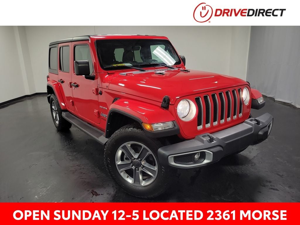 2022 Jeep Wrangler Unlimited Sahara in Firecracker Red Clearcoat — front three-quarter view