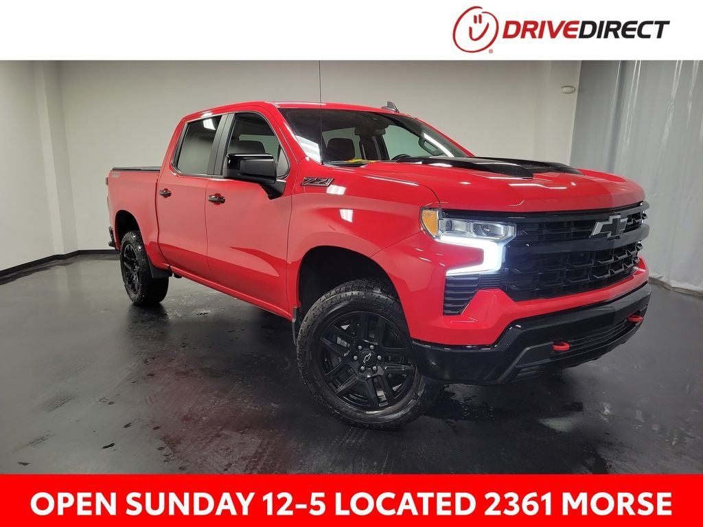 2023 Chevrolet Silverado 1500 LT Trail Boss in Red Hot — front three-quarter view