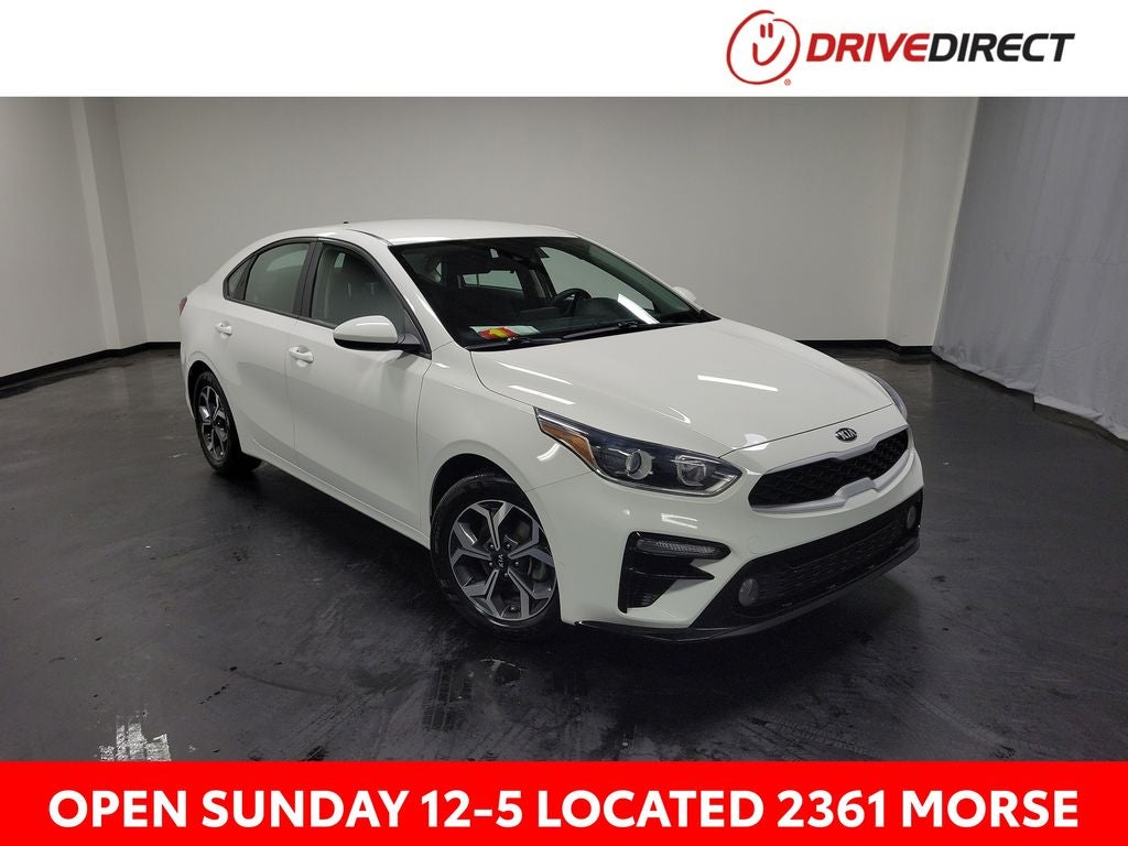 2021 Kia Forte LXS in Clear White — front three-quarter view