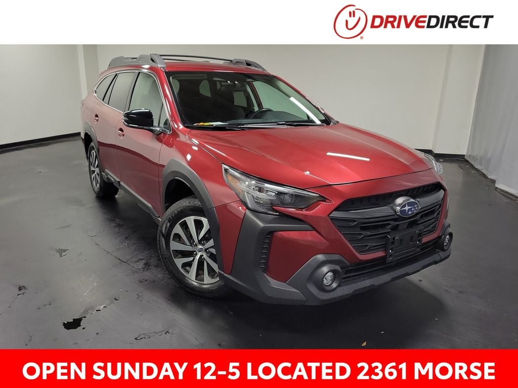 2025 Subaru Outback Premium in Crimson Red Pearl — front three-quarter view