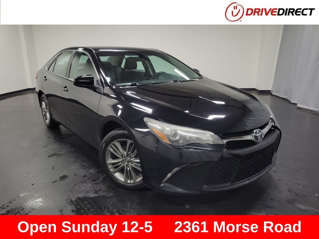 2016 Toyota Camry SE in Midnight Black Metallic — front three-quarter view