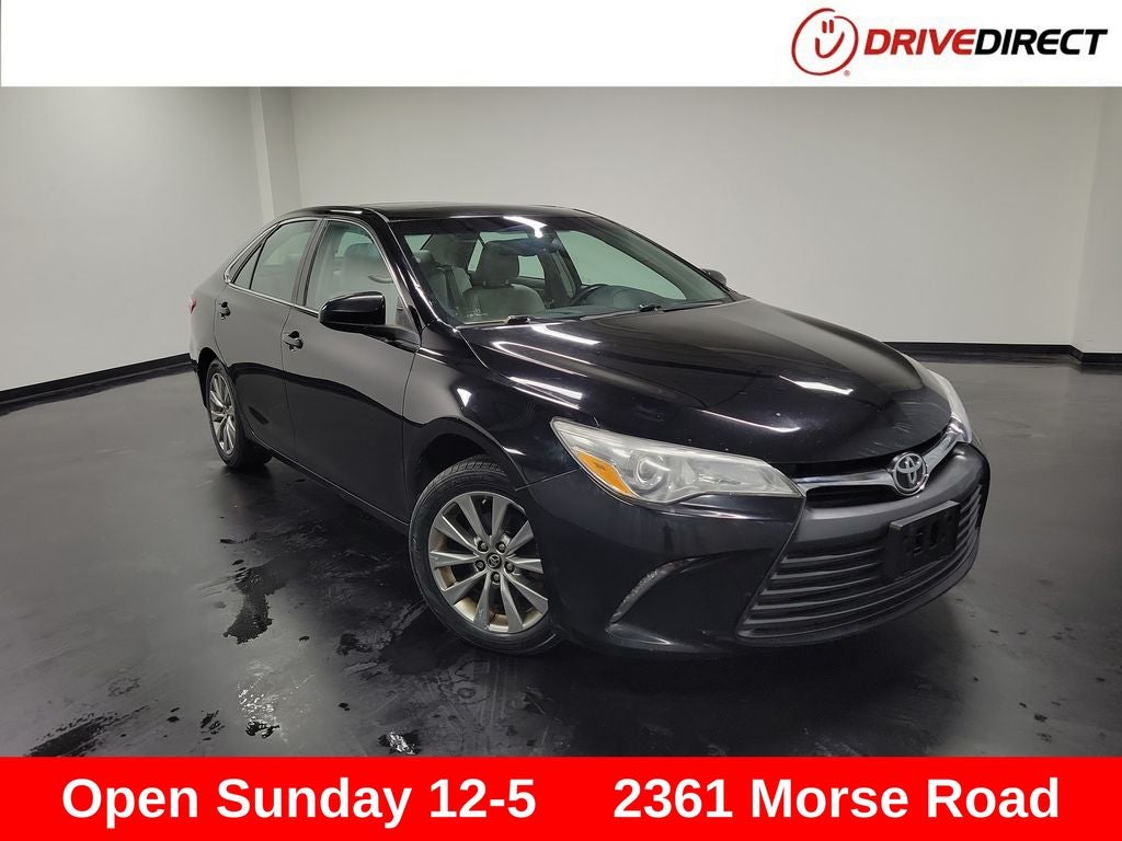 2017 Toyota Camry XLE in Midnight Black Metallic — front three-quarter view