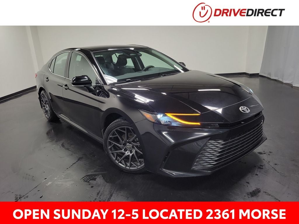 2025 Toyota Camry XLE in Midnight Black Metallic — front three-quarter view