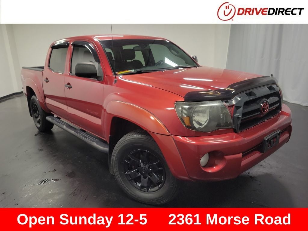 2007 Toyota Tacoma Base V6 in Impulse Red Pearl — front three-quarter view