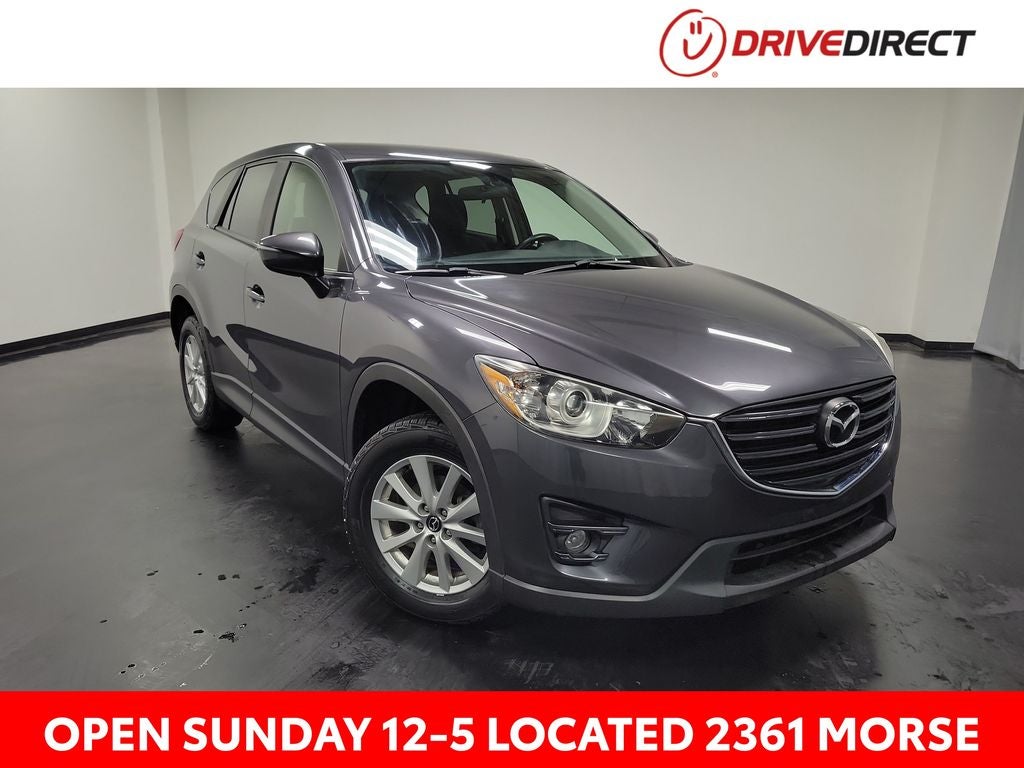 2016 Mazda Mazda CX-5 Touring in Meteor Gray Mica — front three-quarter view
