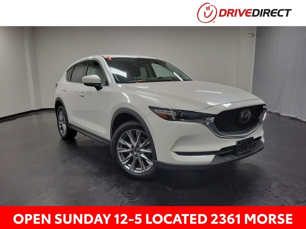 2019 Mazda Mazda CX-5 Grand Touring in Snowflake White Pearl Mica — front three-quarter view